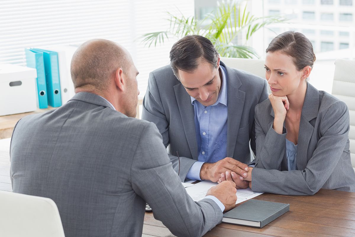 Lender Advising a Couple on Mortgage Financing for a Real Estate Transaction